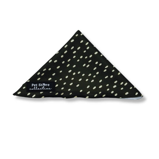 Our olive-green and cream polka dot dog bandana, tie-on style. In sizes S/M 49.5CM x 35CM x 35CM fits necks up to 29CM, M/L 57CM x 40CM x 40CM fits necks up to 39CM.