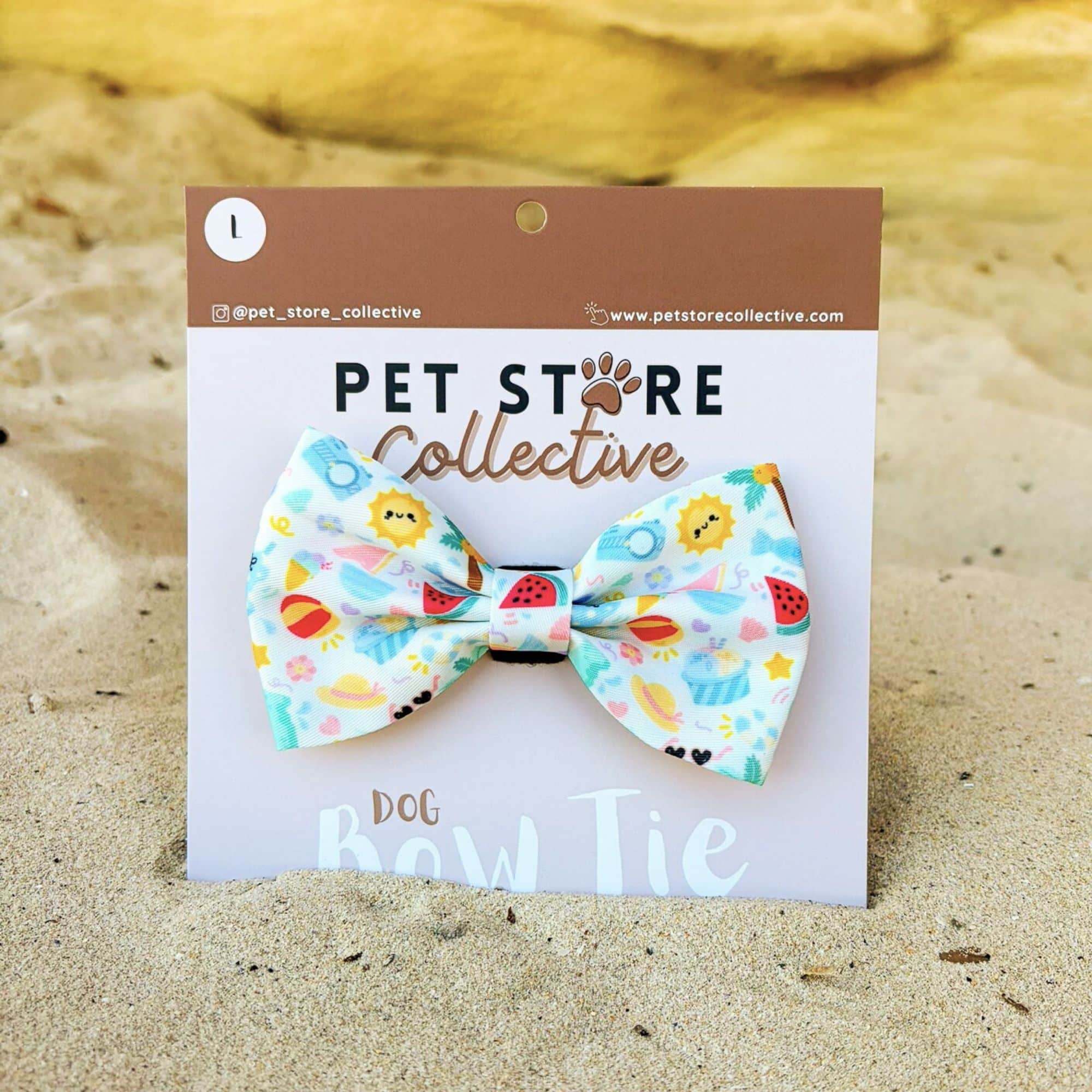 Straight on view of our Summer Bliss dog bow tie. Made from soft polyester fabric with a Velcro backing that attaches to any pet collar, designed for comfort and summer style. Limited release by Pet Store Collective.