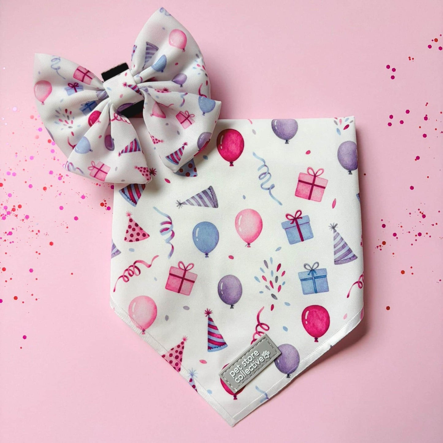 Limited-edition Birthday Girl dog bandana and bow tie set with pink and purple balloons and gift details. Matching sailor bowtie has a velcro backing and attaches to any size collar.