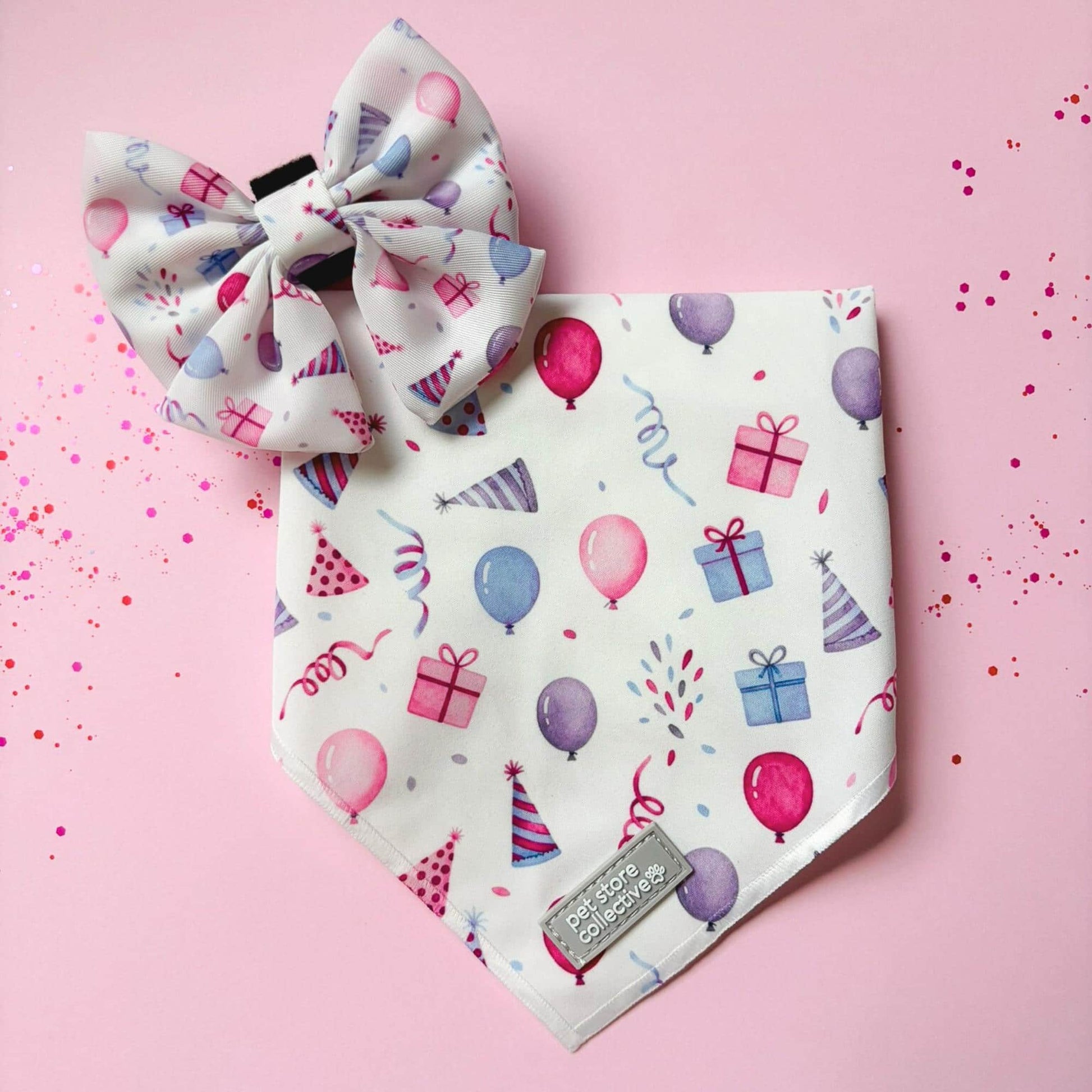 Limited-edition Birthday Girl dog bandana and bow tie set with pink and purple balloons and gift details. Matching sailor bowtie has a velcro backing and attaches to any size collar.