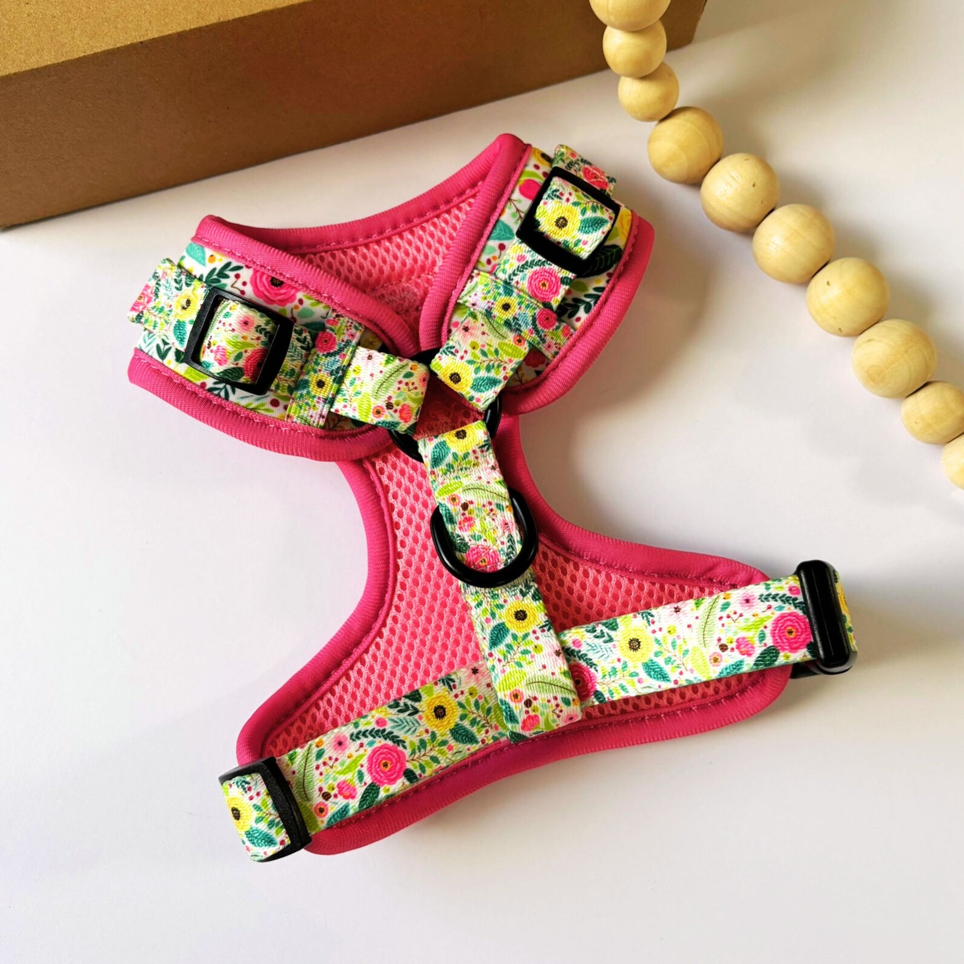Angled back view of our Bloom Floral Adjustable Dog Harness with back D-ring for lead attachment. Featuring our pink floral design, soft padding, and fully adjustable fit for dogs and cats. Available in XXS to L, designed in Australia by Pet Store Collective.