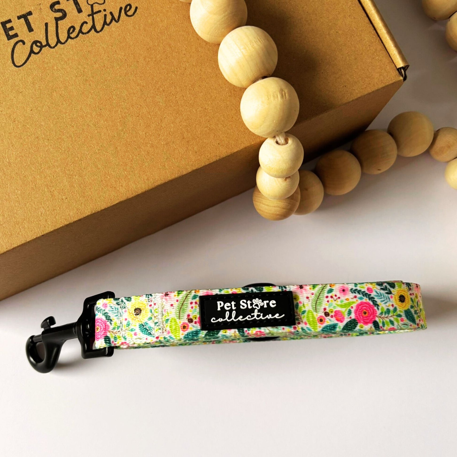 Front view of our Bloom Floral Dog Lead showing our blush floral and greenery design. Featuring our soft neoprene handle, and durable metal swivel clip for secure attachment to your dog’s collar or harness for everyday walks.