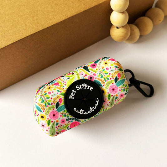 Top view of our Bloom Floral Dog Poop Bag Holder. Our stunning blooming pink roses and greenery design on neoprene, with metal clip for easy attachment to your dog's leads.