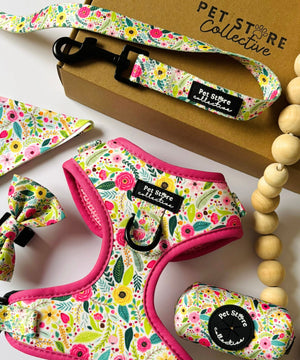 Complete Bloom Floral dog walking set featuring matching harness, collar, lead, bowtie, bandana, and poop bag holder. Designed for stylish and safe, coordinated walks with your pet.