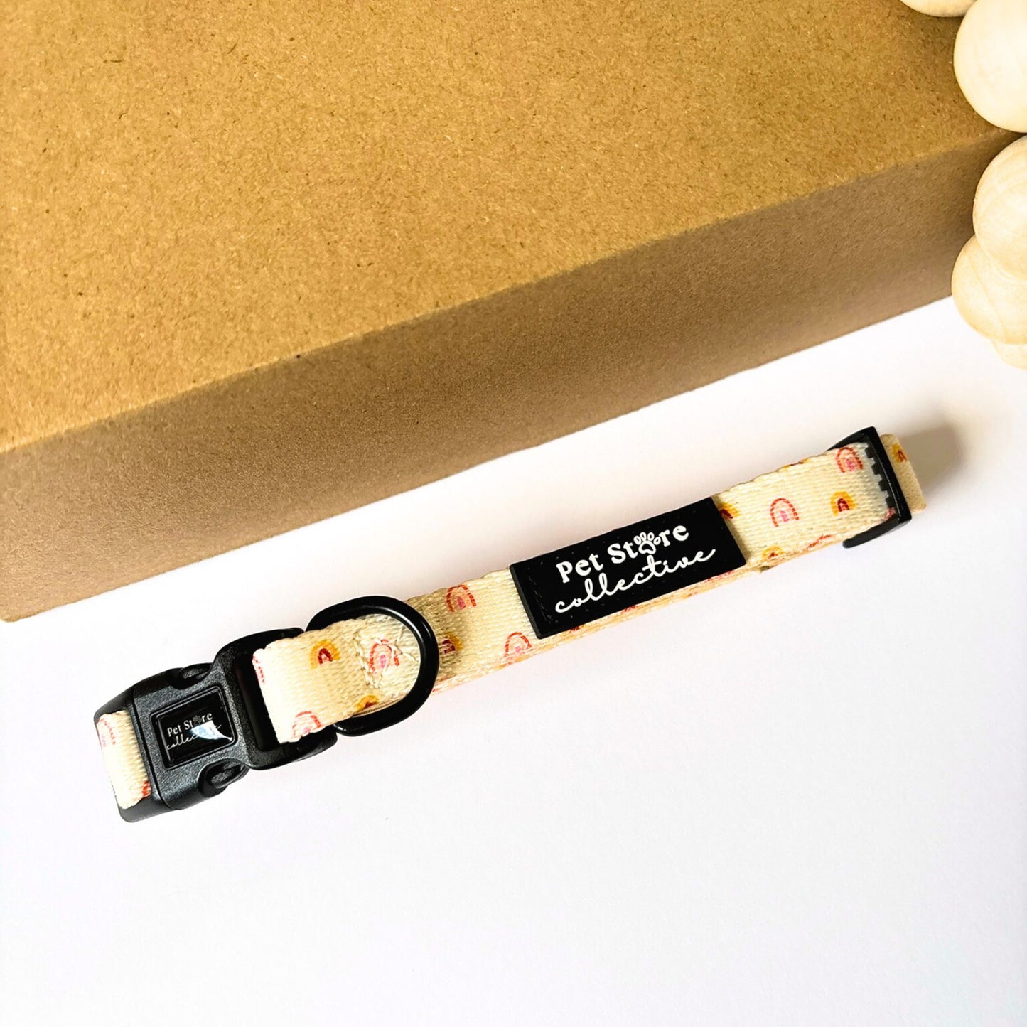 Front view of our Boho Rainbow Dog Collar in soft yellow with golden rainbow print. Featuring our secure 4-point locking buckle and durable D-ring for safe everyday walks, available in sizes XS–L.