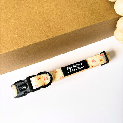 Front view of our Boho Rainbow Dog Collar in soft yellow with golden rainbow print. Featuring our secure 4-point locking buckle and durable D-ring for safe everyday walks, available in sizes XS–L.