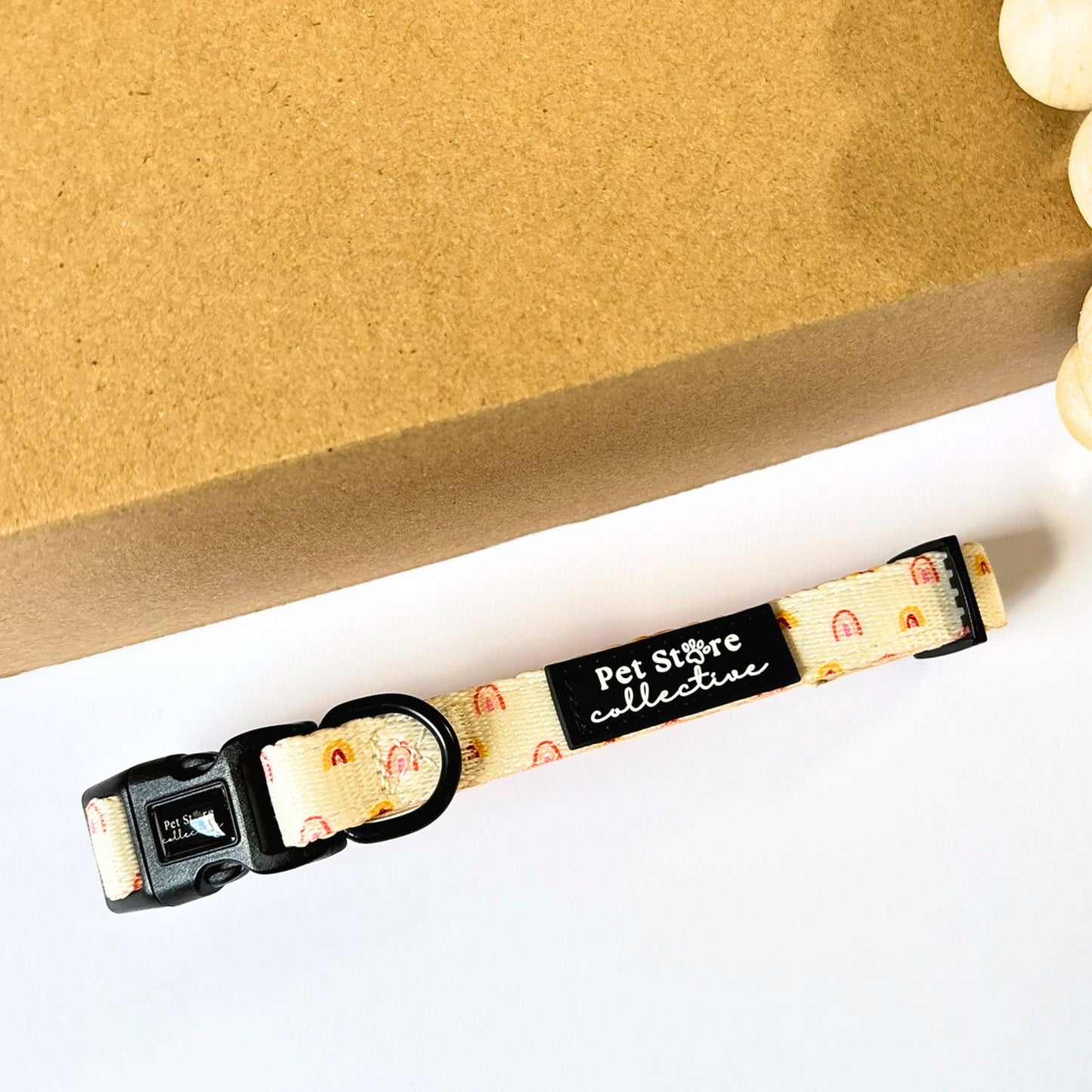 Boho Rainbow Fully adjustable Dog Collar with neoprene padding for comfort. Shown on white background with warm rainbow pattern, designed in Australia and perfect for small to large dogs.