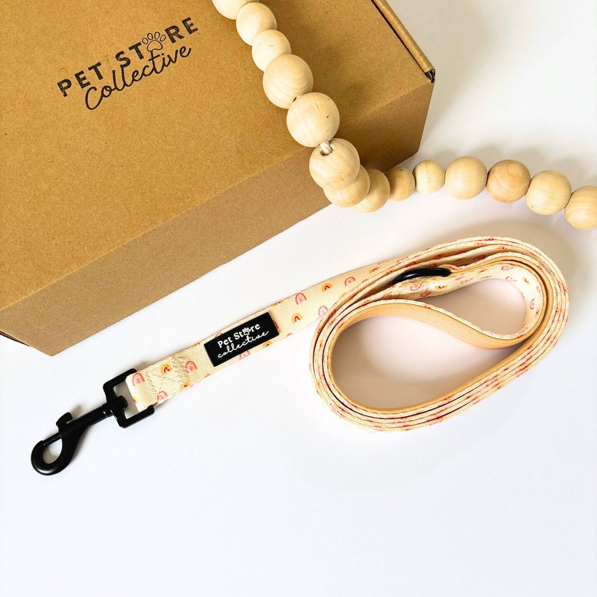 Our Boho Rainbow Dog Lead in soft yellow and golden tones, durable polyester with a swivelling black clip and neoprene-lined handle, designed in Australia by Pet Store Collective.