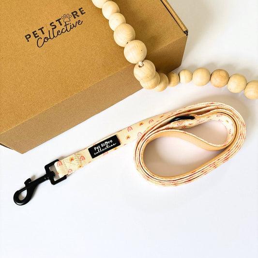 Our Boho Rainbow Dog Lead in soft yellow and golden tones, durable polyester with a swivelling black clip and neoprene-lined handle, designed in Australia by Pet Store Collective.