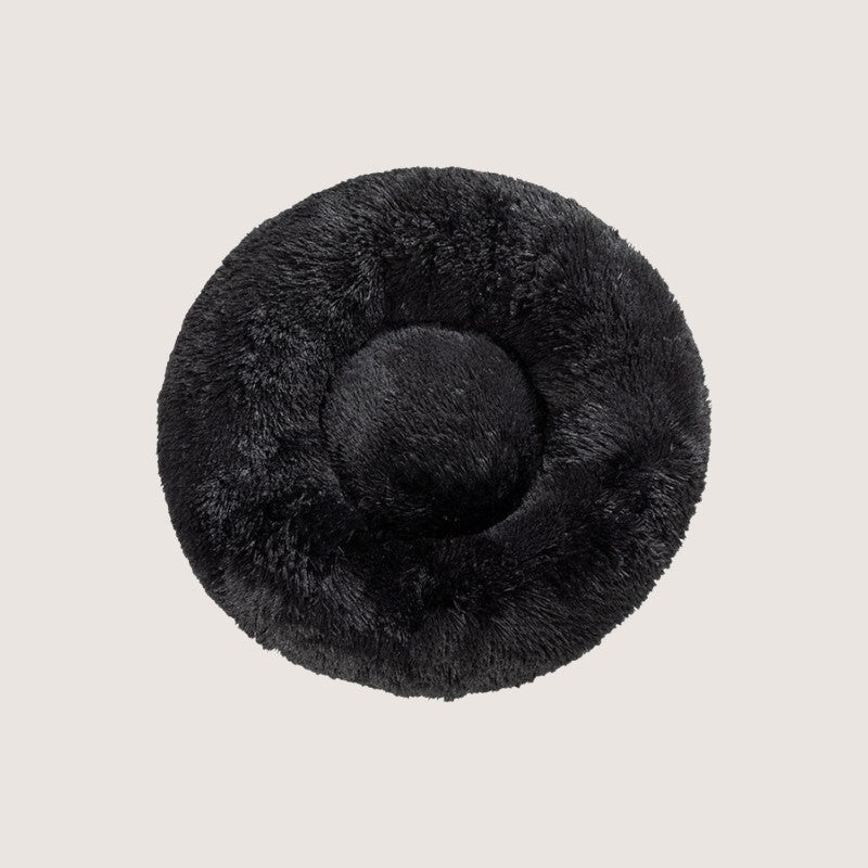 Black Calming Donut Pet Bed: Experience ultimate pet comfort with our best-selling dog bed. Embrace security with its circular design for a sense of cosiness and warmth. Raised edges provide neck and body support. Crafted from plush materials for extra softness and easy machine washable maintenance.