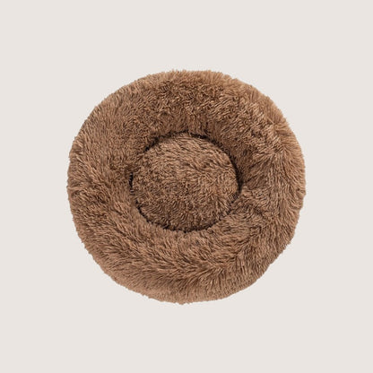 Light Brown Calming Donut Pet Bed: Experience ultimate pet comfort with our best-selling dog bed. Embrace security with its circular design for a sense of cosiness and warmth. Raised edges provide neck and body support. Crafted from plush materials for extra softness and easy machine washable maintenance.