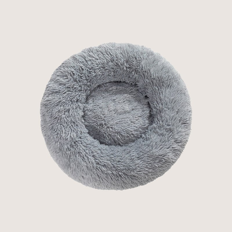 Light Grey Calming Donut Pet Bed: Experience ultimate pet comfort with our best-selling dog bed. Embrace security with its circular design for a sense of cosiness and warmth. Raised edges provide neck and body support. Crafted from plush materials for extra softness and easy machine washable maintenance.