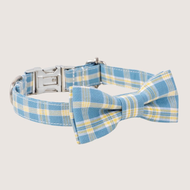 Blue Colour: Stylish gingham bow tie dog collars crafted from premium cotton, available in four sizes: extra small, small, medium, and large. Adjustable ranges from 15cm to 60cm ensure a perfect fit for your furry friend. Features zinc alloy hardware, including a D-ring and quick-release buckle for convenience. Detachable bow tie offers versatile styling options. Choose from five timeless colours to match your pup's personality.