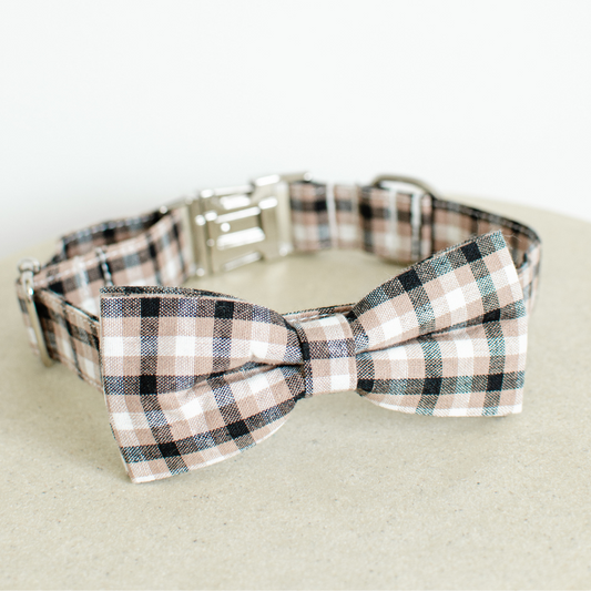 Black Colour: Stylish gingham bow tie dog collars crafted from premium cotton, available in four sizes: extra small, small, medium, and large. Adjustable ranges from 15cm to 60cm ensure a perfect fit for your furry friend. Features zinc alloy hardware, including a D-ring and quick-release buckle for convenience. Detachable bow tie offers versatile styling options. Choose from five timeless colours to match your pup's personality.