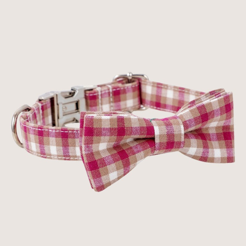 Pink Colour: Stylish gingham bow tie dog collars crafted from premium cotton, available in four sizes: extra small, small, medium, and large. Adjustable ranges from 15cm to 60cm ensure a perfect fit for your furry friend. Features zinc alloy hardware, including a D-ring and quick-release buckle for convenience. Detachable bow tie offers versatile styling options. Choose from five timeless colours to match your pup's personality.