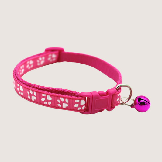 Hot Pink Colour: Give your pet's style a boost with our cute paw print collars! Available in 12 vibrant colours, each collar comes with an attached bell for extra charm and is super easy to adjust. Shop now to add some flair to your furry friend's look!