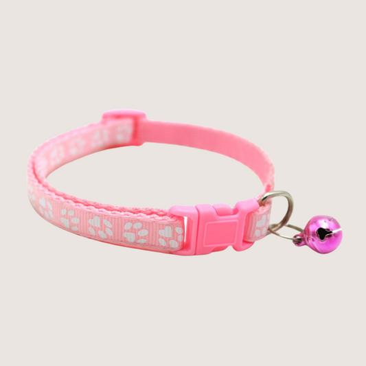 Pink Colour: Give your pet's style a boost with our cute paw print collars! Available in 12 vibrant colours, each collar comes with an attached bell for extra charm and is super easy to adjust. Shop now to add some flair to your furry friend's look!