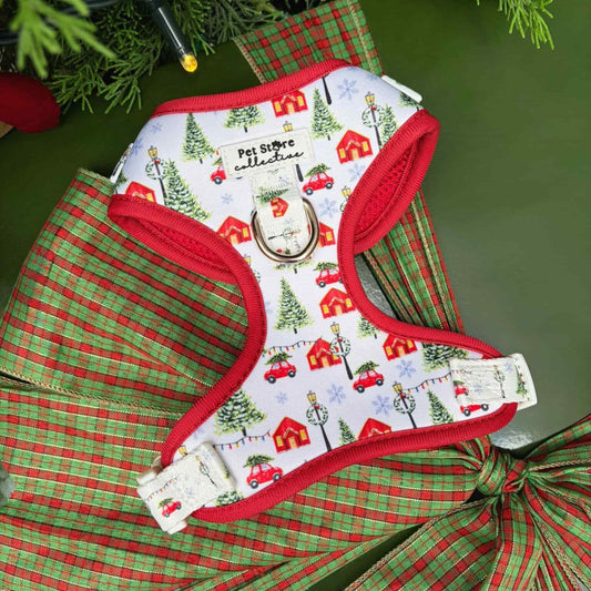Our limited release Christmas Magic Adjustable Dog Harness. A festive red and white design featuring Christmas trees, cottages, and twinkling lights. Crafted from lightweight, quick-dry neoprene with breathable mesh for comfort and festive style.