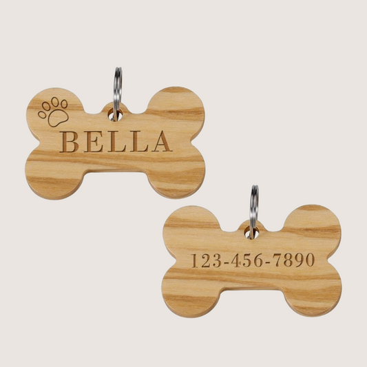 Light Wood Pet ID Tags: Unique, personalised wooden identification tags, essential for pet safety. Each tag boasts a distinct pattern, available in light or dark wood. Enjoy free engraving and free shipping across Australia, USA, UK, and Germany. Size: Height: 0.98 inch x Width: 1.57 inch.