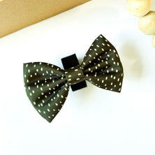 Dottie Days olive green dog bow tie flat lay with soft cream polka dots by Pet Store Collective.