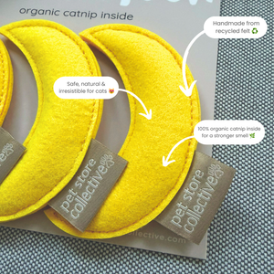 Handmade recycled felt moon catnip toys by Pet Store Collective showing organic catnip filling and eco-friendly materials with product annotations.