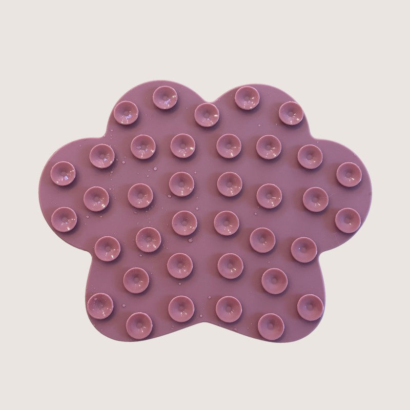 Pink Colour: Back Of Lick Mat With Suction Cups: Durable and Safe Paw Lick Mats crafted from thick, BPA-free, non-toxic silicone for stress-free mealtime and bath time. Stimulating design encourages mental engagement, while suction cups ensure stability during grooming sessions.