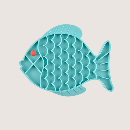 Aqua fish-shaped silicone lick mat with dimensions 19CM x 24.5CM, made from food-grade, BPA-free silicone. Freezer and dishwasher safe, encourages slower eating for better digestion.