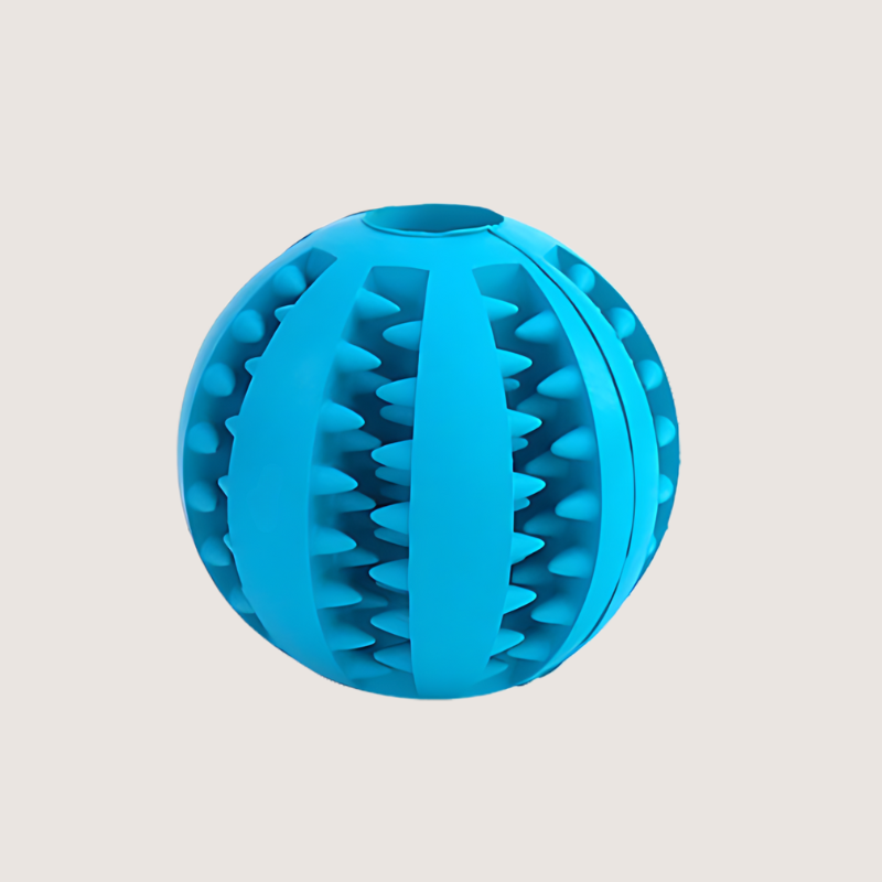 Blue Interactive Treat Ball Toy: Say Goodbye to Plaque with our blue interactive treat ball toy. Crafted from bite-resistant rubber, it keeps your dog mentally engaged, removes plaque, and promotes healthy gums. Available in two sizes: Small (S) with a 5CM circumference and Medium (M) with a 7CM circumference. Perfect for a fun and healthy playtime.