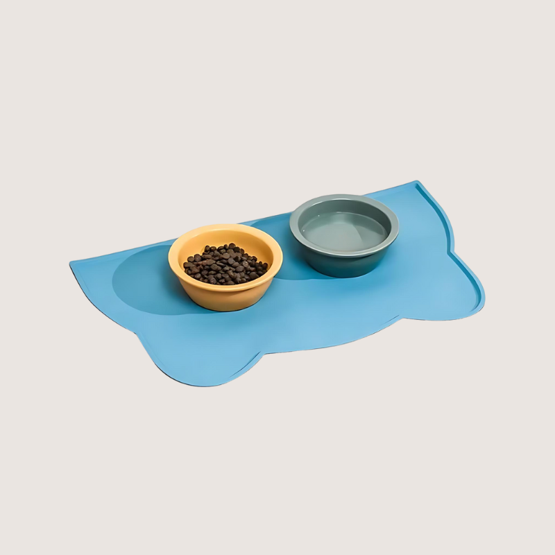 Blue ear-shaped waterproof silicone pet food mat, durable and BPA-free, designed to keep floors clean and add a cute touch.