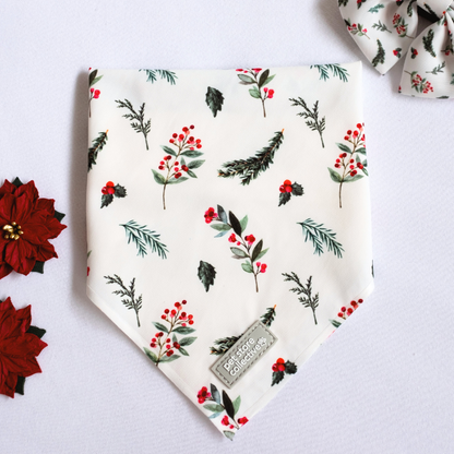 Exclusive Pet Store Collective Mistletoe Bandana & Bow Tie Set featuring red berries and green leaves on a crisp white background. Bandana S/M (25-47cm neck), Bow Tie L 9cm x H 6cm.