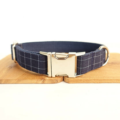 Embrace your pet's unique charm with our Navy Gingham Dog Collar. Made from lightweight polyester for comfort, it features an adjustable side clasp for easy fitting and is available in five sizes to suit all breeds.