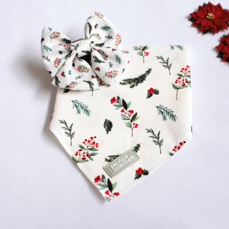 Celebrate the season with our Mistletoe  Pet Bandana & Bow Tie Set, featuring festive red berries and green leaves on a crisp white background. Exclusive to Pet Store Collective. Bandana S/M (25-47cm neck), Bow Tie L 9cm x H 6cm.