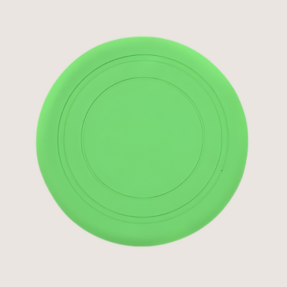 Green silicone dog frisbee, 18cm x 18cm, made from flexible, BPA-free, food-grade silicone. Durable and bite-resistant, ideal for chewers and active play.