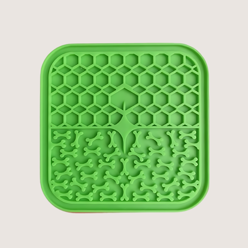 Green Suction Lick Mat made from BPA-free, food-grade silicone. Measures 15 cm in length. Offers mental stimulation, promotes better digestion, and features a durable design. Dishwasher and freezer safe.