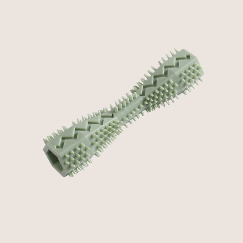   Green Rubber Chew Toy for Dogs: Fill the centre of this 14.2CM long and 3.6CM wide toy with your dog's favourite treats for an added challenge, while ensuring they enjoy every moment. Ideal for dog parents who want to prioritise their dogs' well-being and happiness, one chew at a time.