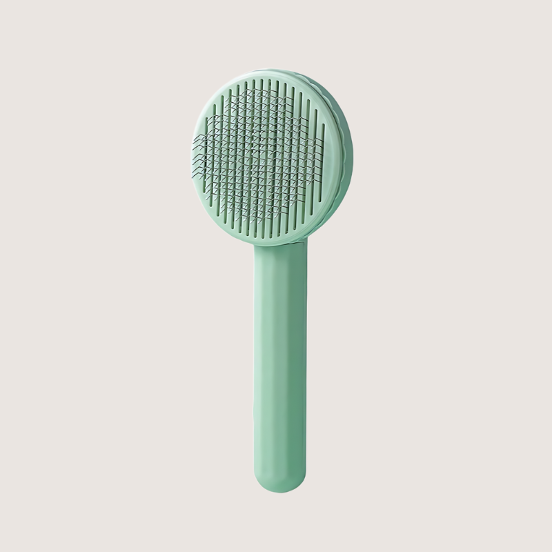 Green stainless-steel slicker brush for small to medium-sized pets. Designed with an anti-slip handle and flexible 60-degree bristles for smooth grooming and quick hair removal.