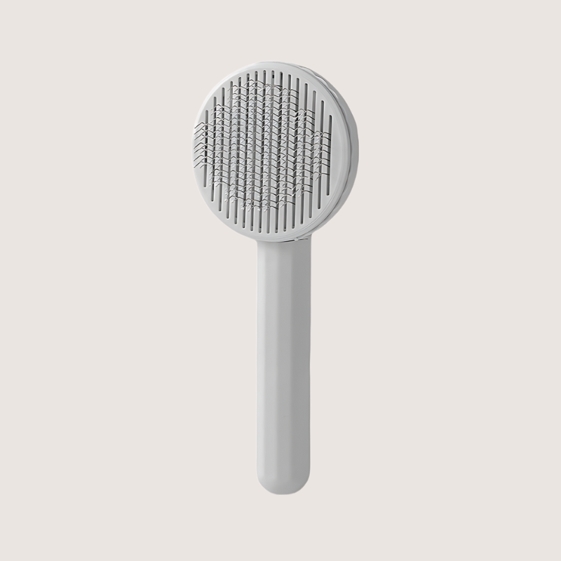 Grey stainless-steel slicker brush, ideal for small to medium-sized pets. Offers a secure grip with its anti-slip handle and 60-degree bent bristles for efficient grooming and easy hair disposal.