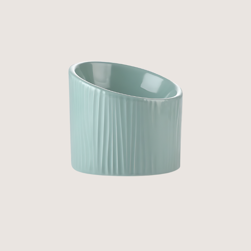 Light green ceramic pet bowl with bark-like textures, dishwasher safe. Elevated design for comfort, 15.5CM wide, 14.5CM back height, 10CM front height, holds 170ML.