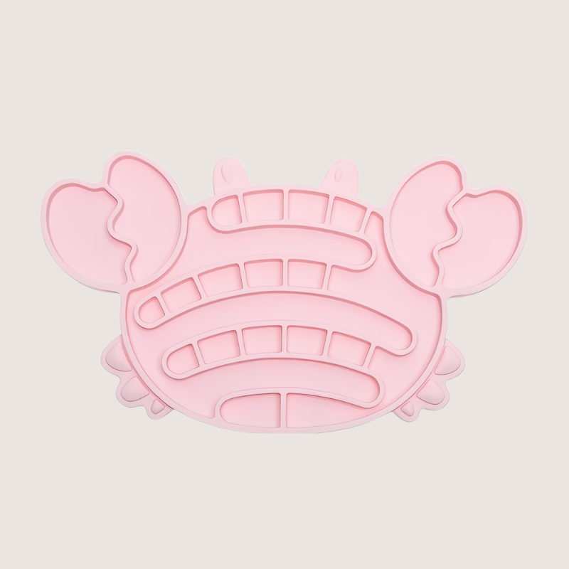 Pink crab-shaped silicone lick mat measuring 11.7CM x 20.1CM, featuring suction cups at the back for secure placement. Made from food-grade, BPA-free silicone, freezer and dishwasher safe, suitable for cats and dogs.