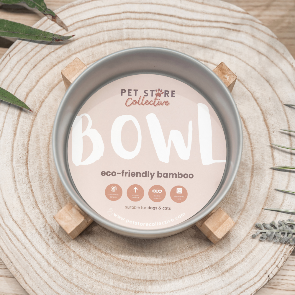 Our Silver Mist Ceramic Pet Bowl with an eco-friendly bamboo base, 19.5 cm long and 9 cm high, with a 3.6 cup (850 ml) capacity. Designed for both food and water, this bowl features high edges to reduce spills and is dishwasher-safe for effortless cleaning. The bowl's sleek silver mist finish and embossed Pet Store Collective logo inside the bottom provide a stylish and practical addition to your home.