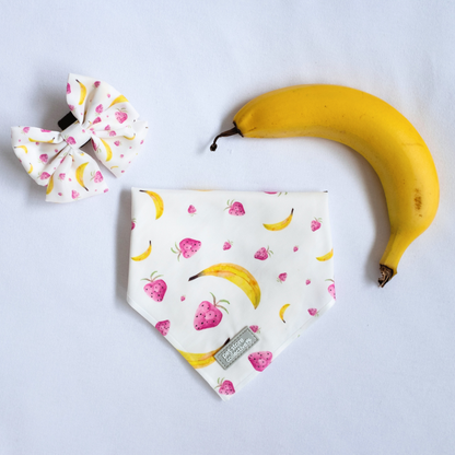 Exclusive design by Pet Store Collective: Limited-edition tropical fruit bandana and bow tie set for pets featuring bananas and strawberries, displayed on a crisp white background (S/M size, neck size 25-47cm, bow tie L 9cm x H 6cm), perfect for small-to-medium dogs and cats.