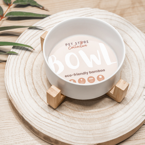 White Cloud Ceramic Pet Bowl with an eco-friendly bamboo base, 19.5 cm long and 9 cm high, with a capacity of 3.6 cups (850 ml). Designed for durability and practicality, this bowl supports your pet’s natural feeding posture, features high edges to reduce spills, and is dishwasher-safe. It includes an embossed Pet Store Collective logo inside the bottom of  our ceramic bowl.