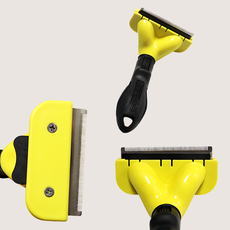 Yellow deshedding brush featuring a stainless-steel comb and ergonomic handle. Designed for efficient hair removal and pet comfort. Available in three stainless-steel comb lengths: Small: 4.5CM. Medium: 6.8CM. Large: 10.2CM.