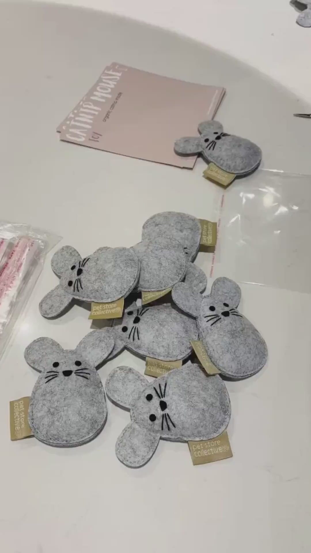Pet Store Collective handmade catnip mouse toys being packaged. Eco-friendly and filled with organic catnip inside, crafted from durable recycled felt for lasting fun.