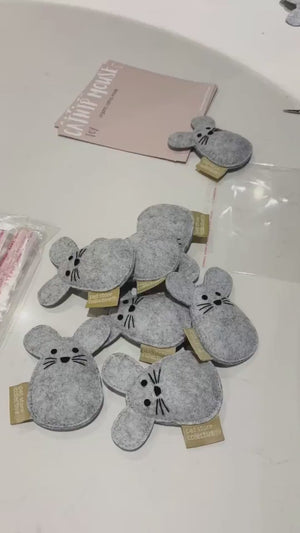 Pet Store Collective handmade catnip mouse toys being packaged. Eco-friendly and filled with organic catnip inside, crafted from durable recycled felt for lasting fun.