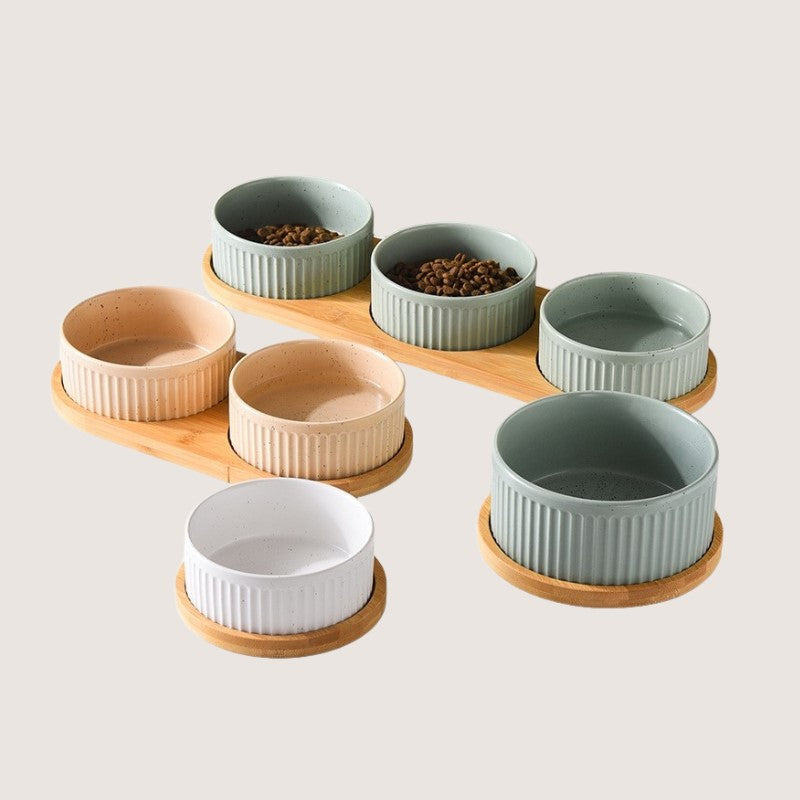 Light Green, Earthy Pastel, and White Colour Range: Stylish ceramic bowls with eco-friendly bamboo bases provide convenience and hygiene for your home. Available in single bowl with bamboo base, two bowls with base, three bowls with bamboo base, and single pet bowls on their own. Anti-slip bamboo bases prevent spills, while dishwasher-safe design simplifies cleanup. Elevate your pet's dining experience with these high-quality, antibacterial bowls, ensuring style and functionality in every meal.
