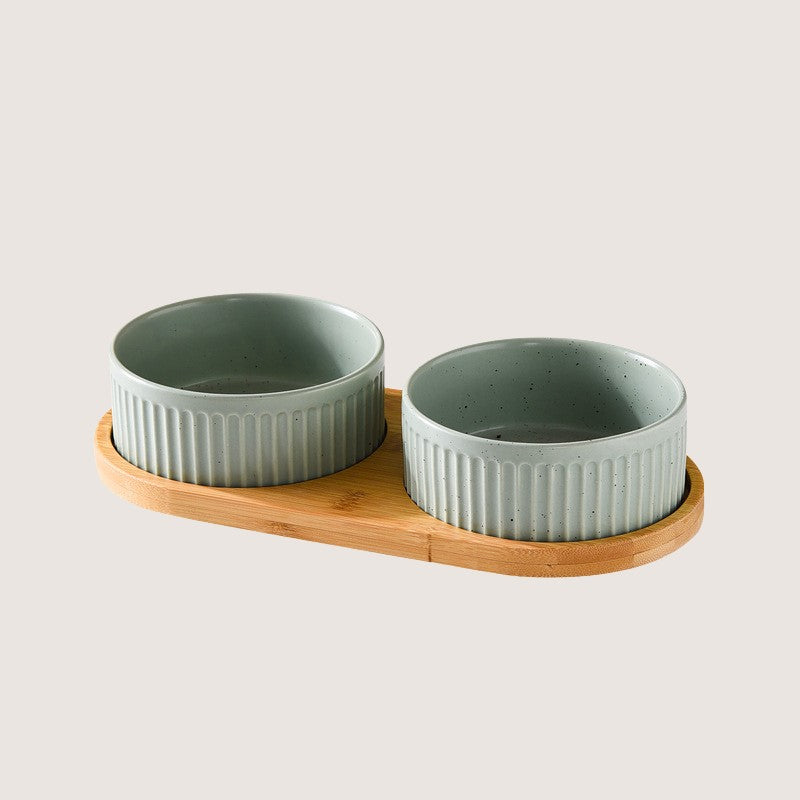 Light Green Two Bowls with Base: Stylish ceramic bowls with eco-friendly bamboo bases provide convenience and hygiene for your home. Available in single bowl with bamboo base, two bowls with base, three bowls with bamboo base, and single pet bowls on their own. Anti-slip bamboo bases prevent spills, while dishwasher-safe design simplifies cleanup. Elevate your pet's dining experience with these high-quality, antibacterial bowls, ensuring style and functionality in every meal.