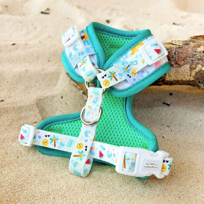 Back view of our limited release Summer Bliss Adjustable Dog Harness showing our adjustable straps, back D-ring for everyday walks, and breathable  turquoise rim for all day comfort. Fully adjustable around the neck and chest for a secure, custom fit, part of Pet Store Collective’s exclusive Summer Bliss Collection. 