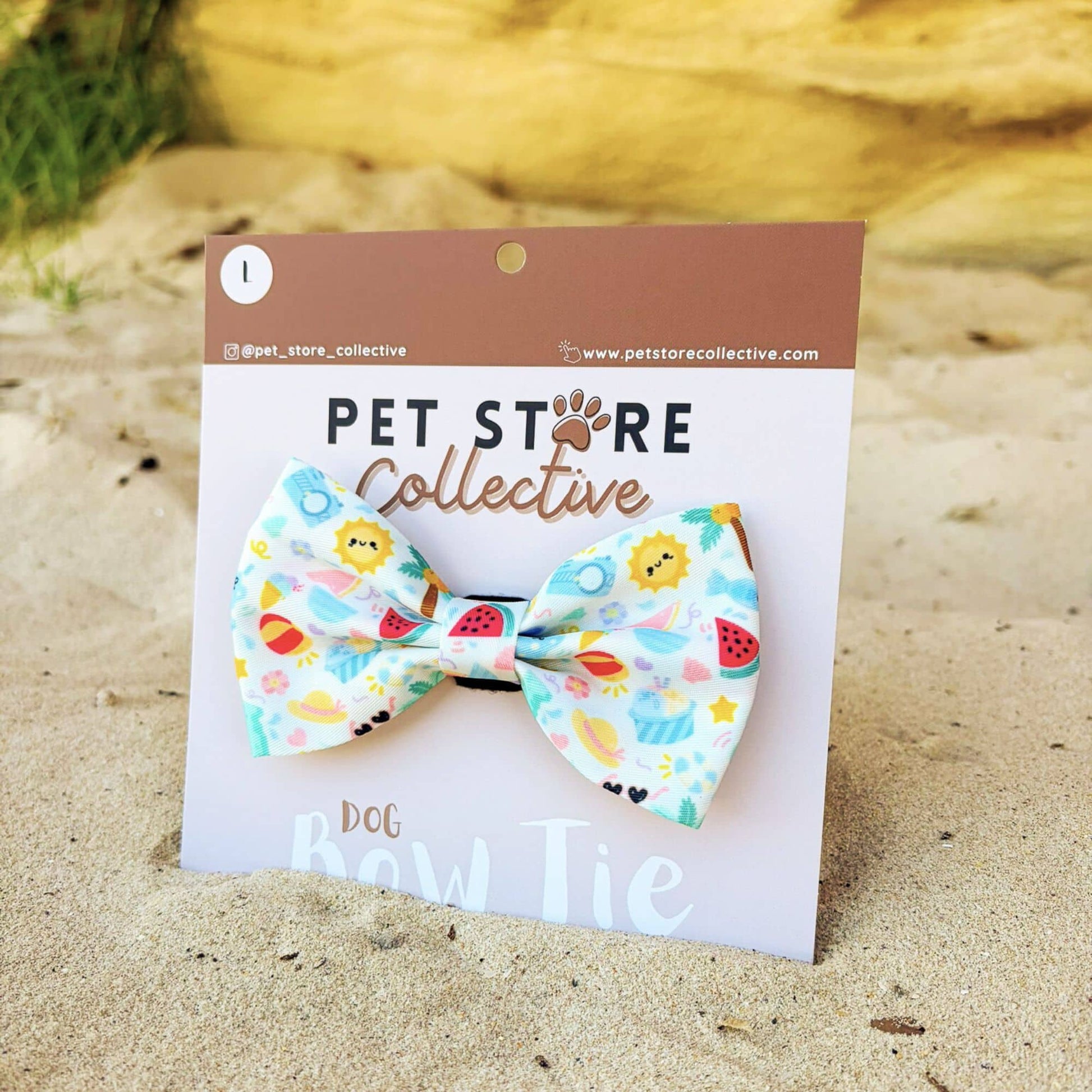 Angled view of our Summer Bliss dog bow tie. Crafted from soft polyester fabric with a secure Velcro backing that attaches to any pet collar. Designed for everyday comfort and bright summer style. Limited release by Pet Store Collective, available in two sizes.