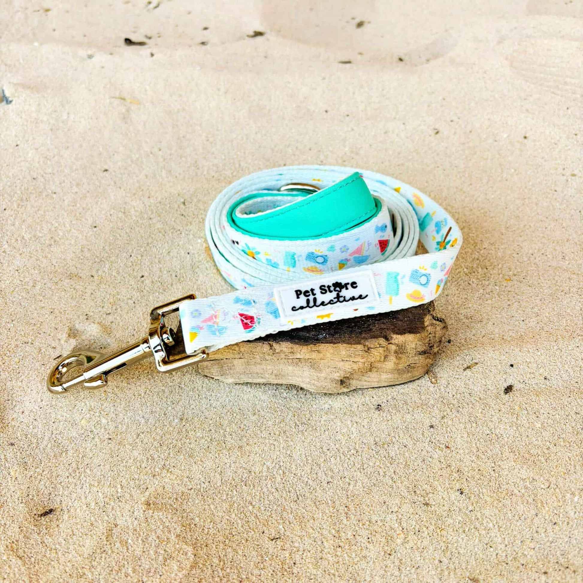 Our limited release Summer Bliss Dog Lead displayed on soft sand, showcasing our sunny beach style design and sturdy zinc-alloy clip. Designed in Australia for sunny walks, park playdates, and relaxed beach strolls.